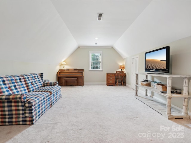 sitting room with carpet flooring and lofted ceiling