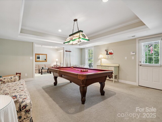 game room with light colored carpet, a raised ceiling, a healthy amount of sunlight, and billiards