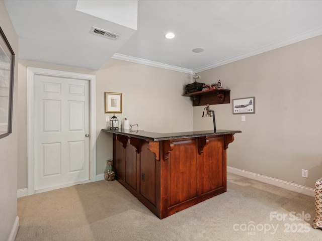 bar with ornamental molding and light carpet