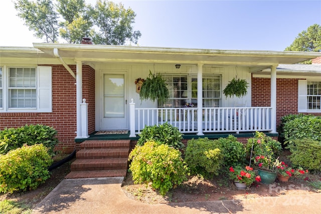 property entrance with a porch