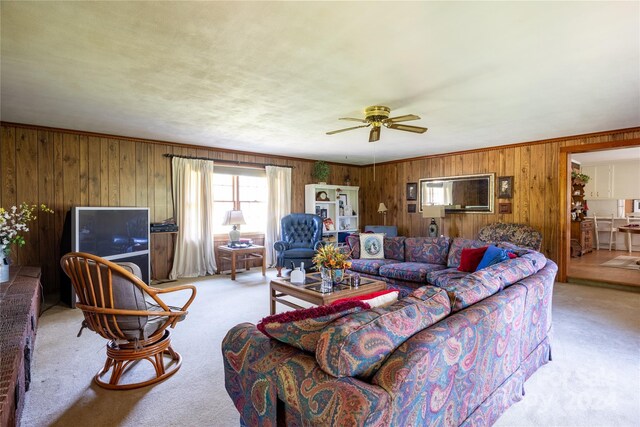 living room featuring ceiling fan and carpet floors