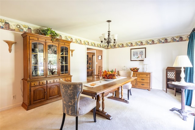 dining area featuring light colored carpet, a chandelier, and crown molding