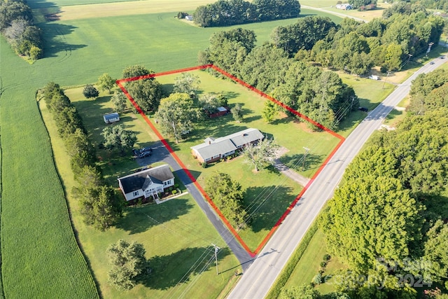 birds eye view of property with a rural view