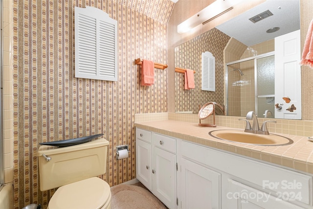 bathroom featuring toilet, decorative backsplash, and vanity