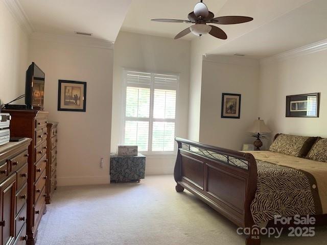 19307 Beaufain St, Cornelius, NC 28031 - bedroom featuring light colored carpet, ornamental molding, visible vents, a ceiling fan, and baseboards
