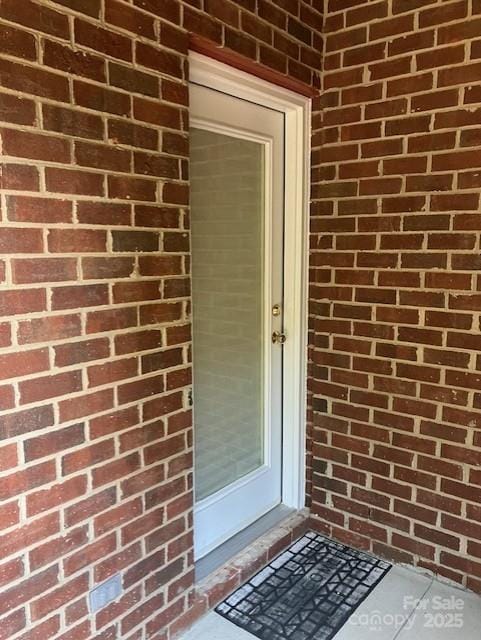 19307 Beaufain St, Cornelius, NC 28031 - doorway to property with brick siding