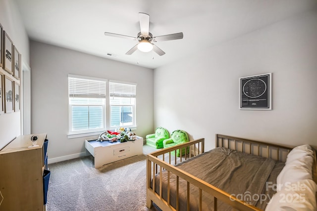 bedroom featuring dark colored carpet and ceiling fan