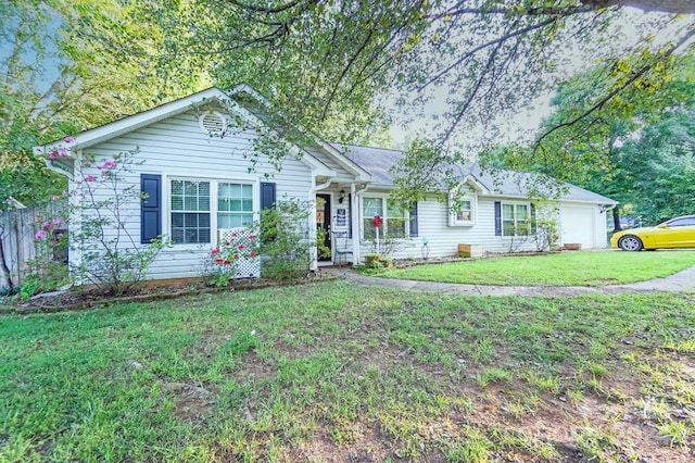 ranch-style home featuring a garage and a front yard