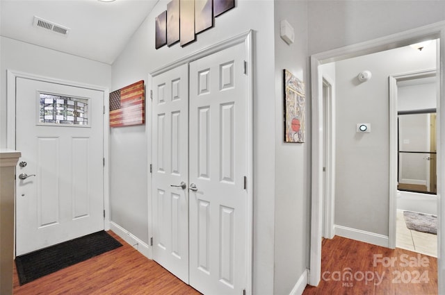 foyer with wood-type flooring