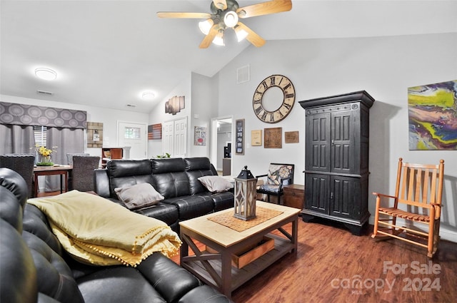 living room with ceiling fan, vaulted ceiling, and wood-type flooring