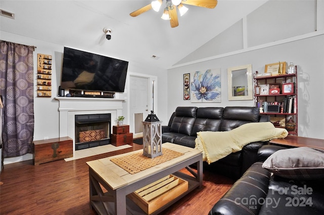 living room with ceiling fan, high vaulted ceiling, and wood-type flooring