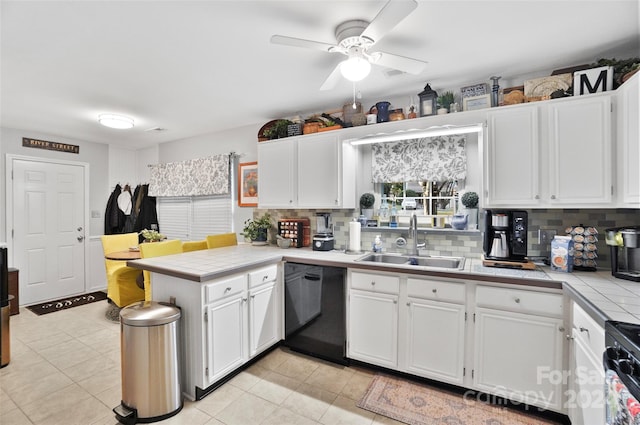 kitchen with decorative backsplash, white cabinets, dishwasher, sink, and light tile patterned flooring