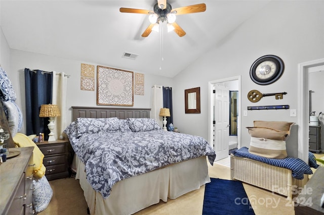 carpeted bedroom with ceiling fan and vaulted ceiling