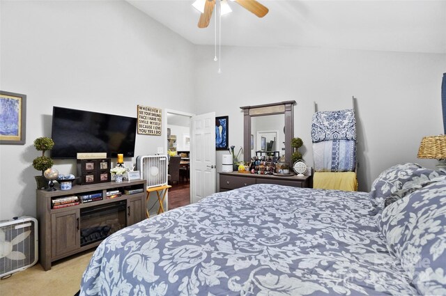 carpeted bedroom featuring ceiling fan and high vaulted ceiling