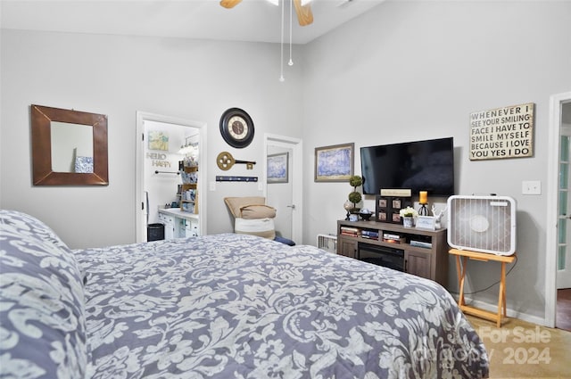 bedroom with ceiling fan, carpet flooring, and high vaulted ceiling