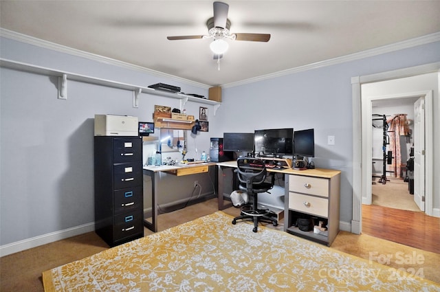 office area featuring ceiling fan, ornamental molding, and light colored carpet