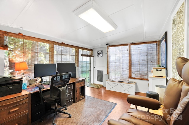 office with a healthy amount of sunlight and wood-type flooring