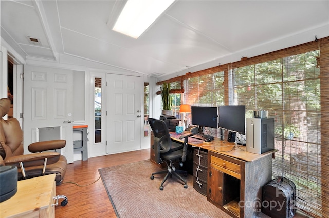 office area with hardwood / wood-style floors and vaulted ceiling