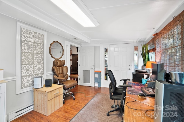 home office featuring hardwood / wood-style flooring and baseboard heating