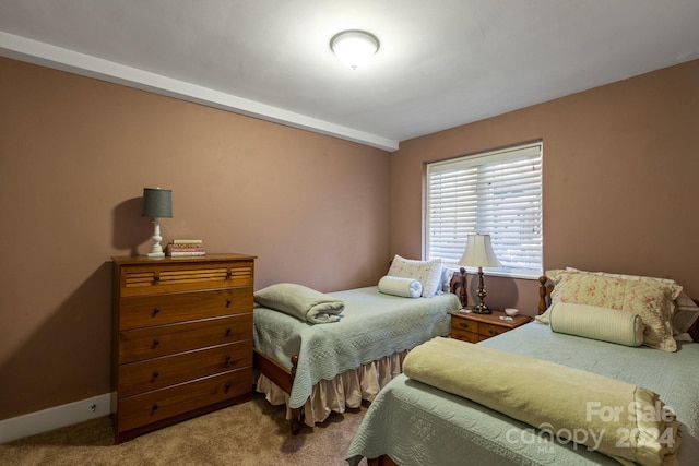 bedroom with baseboards and carpet flooring