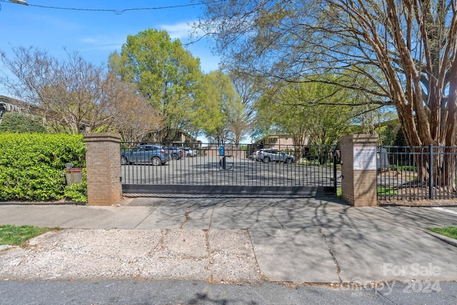 view of gate featuring fence