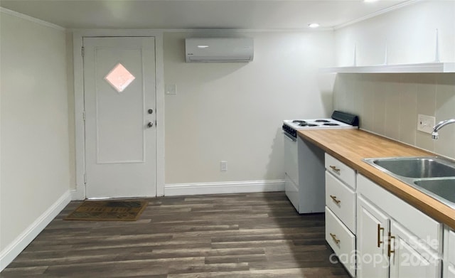 kitchen with a wall mounted AC, white cabinetry, dark hardwood / wood-style floors, and white stove