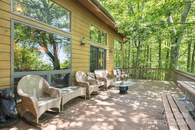 wooden deck featuring an outdoor hangout area