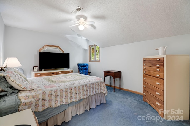 bedroom featuring ceiling fan, vaulted ceiling, a textured ceiling, and carpet floors