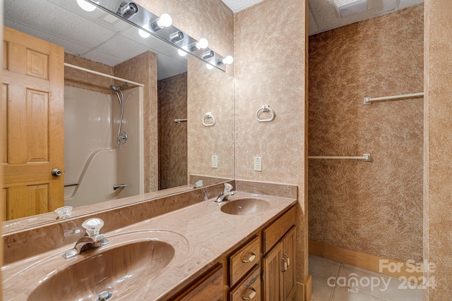 bathroom featuring double sink vanity and tile patterned flooring