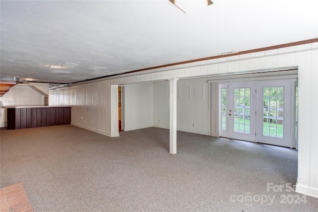 basement featuring a textured ceiling