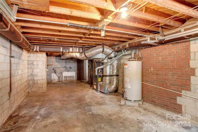 basement with gas water heater and heating unit