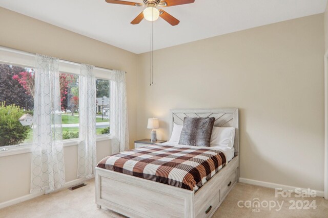 23 Country Meadows Ln, Hendersonville, NC 28792 - bedroom with light colored carpet, baseboards, a ceiling fan, and visible vents