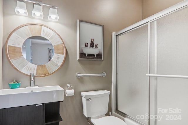 23 Country Meadows Ln, Hendersonville, NC 28792 - bathroom with toilet, vanity, and a shower with shower door
