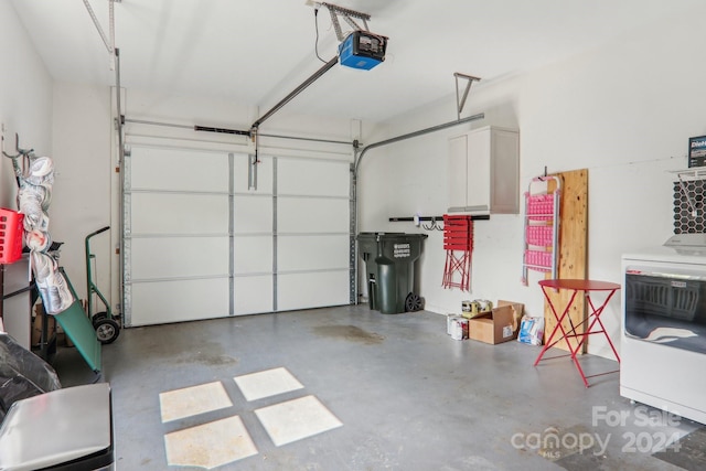 23 Country Meadows Ln, Hendersonville, NC 28792 - garage with washer / clothes dryer and a garage door opener