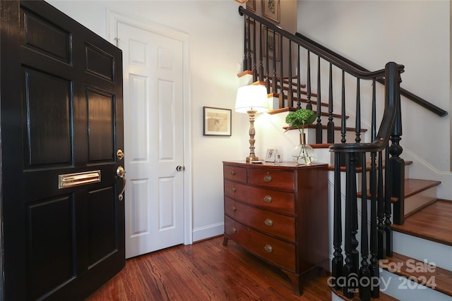 staircase featuring wood-type flooring