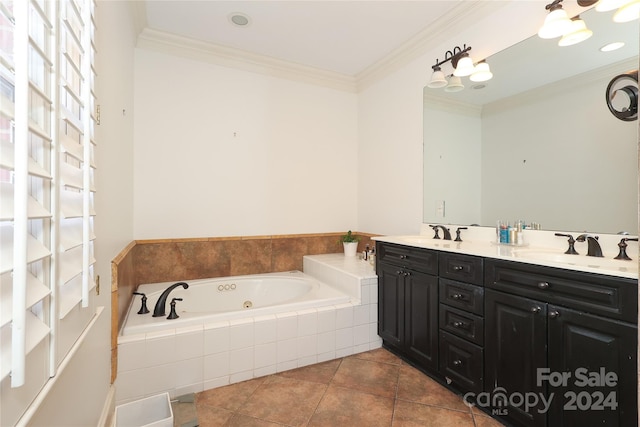 bathroom with tile patterned floors, tiled bath, crown molding, and dual vanity