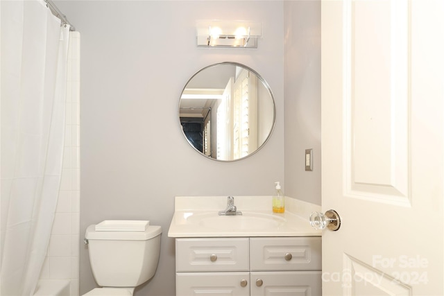 full bathroom featuring toilet, vanity, and shower / tub combo