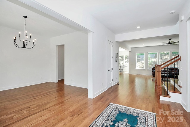 interior space featuring hardwood / wood-style flooring and an inviting chandelier