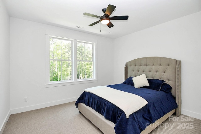 bedroom with ceiling fan and carpet