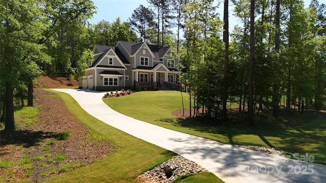 view of front of home featuring a garage and a front yard