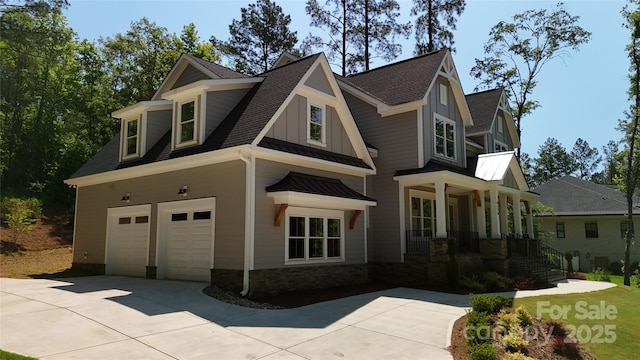 craftsman inspired home featuring a porch and a garage