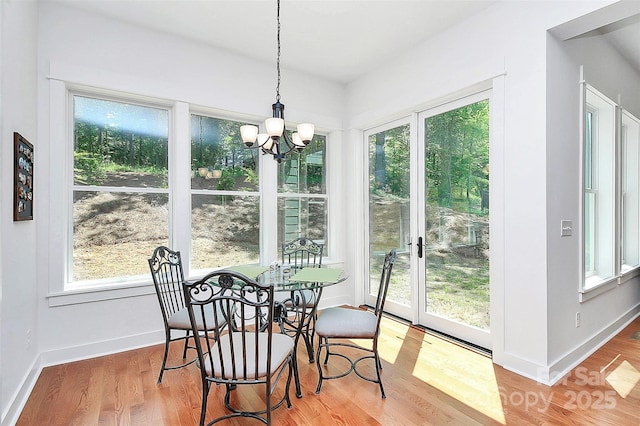 6178 Chimney Bluff Rd, Lancaster, SC 29720 - dining area with an inviting chandelier, baseboards, and wood finished floors