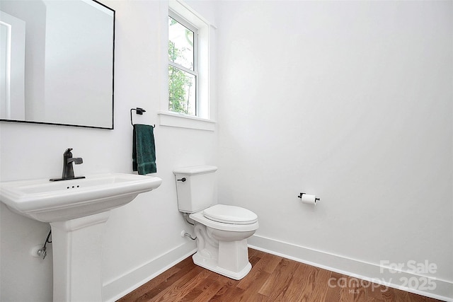6178 Chimney Bluff Rd, Lancaster, SC 29720 - half bathroom featuring baseboards, toilet, and wood finished floors