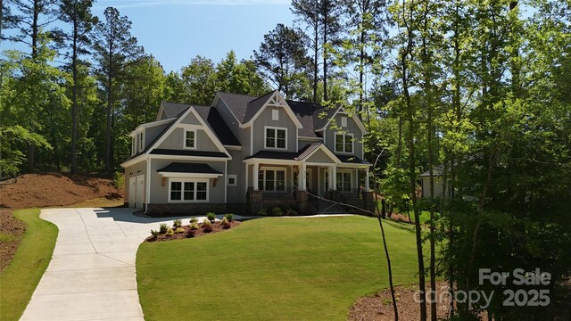 6178 Chimney Bluff Rd, Lancaster, SC 29720 - craftsman inspired home with driveway, a garage, and a front lawn
