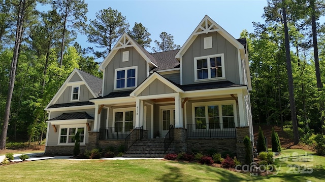 6178 Chimney Bluff Rd, Lancaster, SC 29720 - craftsman inspired home with a standing seam roof, board and batten siding, a front lawn, a shingled roof, and a porch