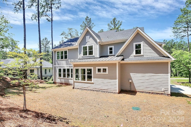 6178 Chimney Bluff Rd, Lancaster, SC 29720 - rear view of house with metal roof and a standing seam roof
