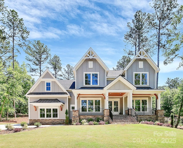 6178 Chimney Bluff Rd, Lancaster, SC 29720 - back of property with a porch, a standing seam roof, board and batten siding, and a yard