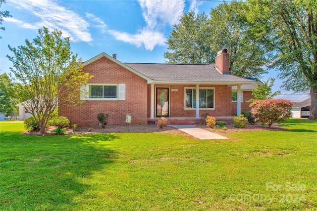 ranch-style home with a front lawn