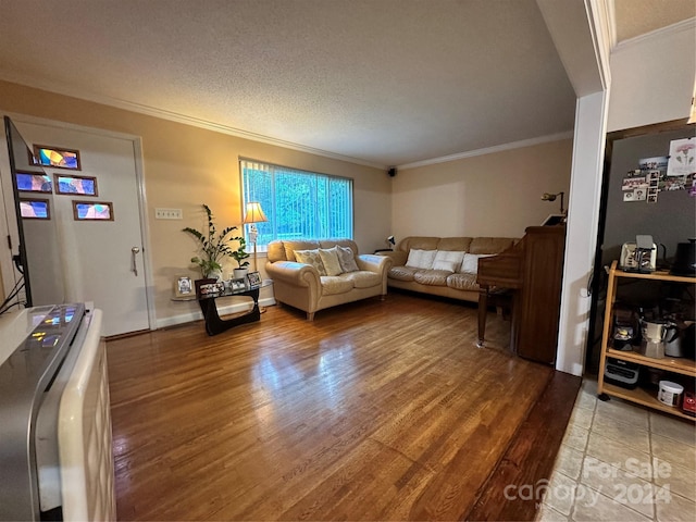 living room featuring light hardwood / wood-style floors, crown molding, and a textured ceiling