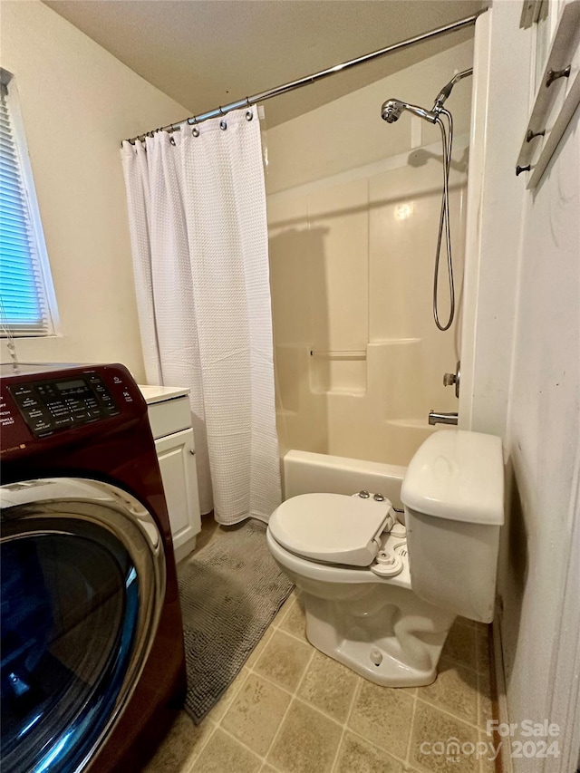 full bathroom featuring shower / bath combination with curtain, vanity, washer / dryer, and toilet